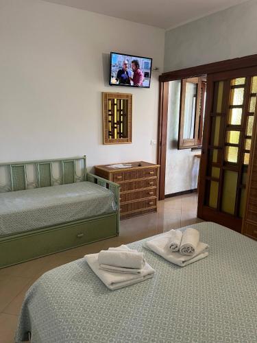 Postel nebo postele na pokoji v ubytování Agriturismo Cally Cally