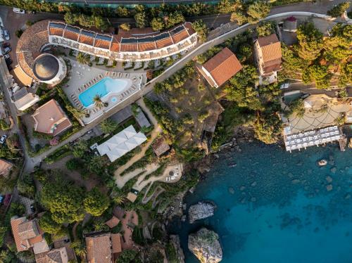 an aerial view of a resort with a swimming pool at Le Calette Bay in Cefalù