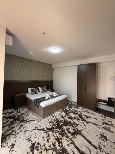 Ένα ή περισσότερα κρεβάτια σε δωμάτιο στο Zamon Hotel