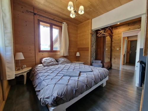 Кровать или кровати в номере Lodge La Tuvière