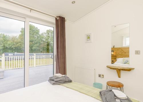 Ένα ή περισσότερα κρεβάτια σε δωμάτιο στο Winston Farm Lodges