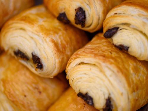 a pile of croissants with raisins at ibis budget Hotel Luzern City in Luzern
