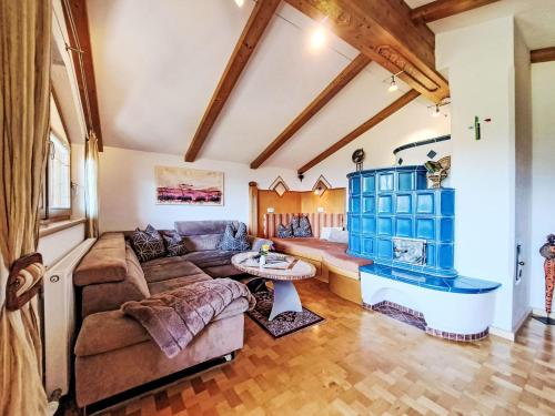 a living room with a couch and a table at Apartment Berganger by Interhome in Bernau