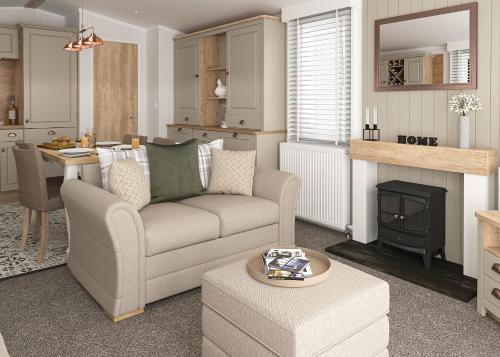 a living room with a couch and a table at Aber Bay Holiday Park in Aberystwyth