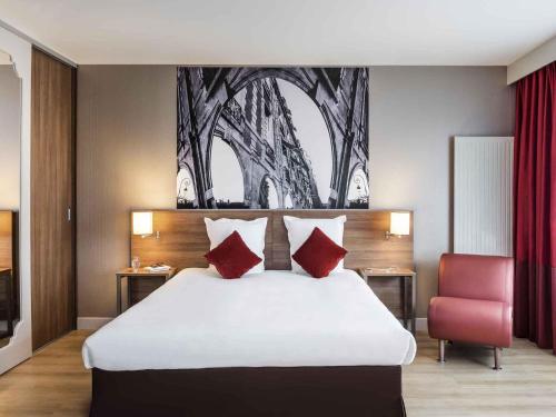 Letto o letti in una camera di Aparthotel Adagio Paris Bercy Village