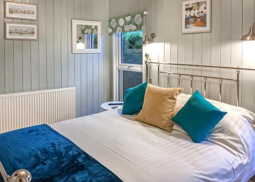 Ένα ή περισσότερα κρεβάτια σε δωμάτιο στο Hollybrook Lodges