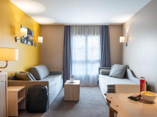 Aparthotel Adagio Val d'Europe près de Disneyland Parisにあるシーティングエリア