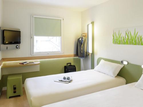 Postel nebo postele na pokoji v ubytování ibis budget Newport