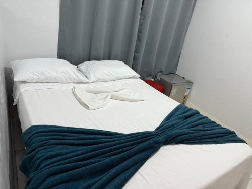 Ένα ή περισσότερα κρεβάτια σε δωμάτιο στο Hostel Evaldo Oliveira