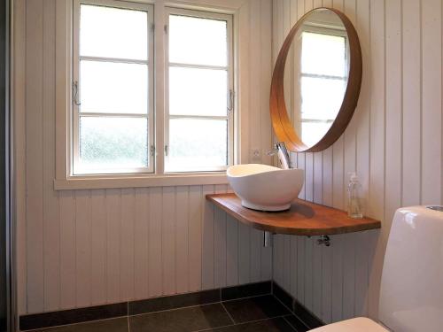 a bathroom with a sink and a mirror at 7 person holiday home in Kirke Hyllinge-By Traum in Kirke-Hyllinge