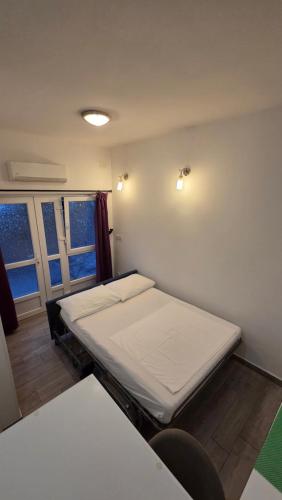 a hospital room with two beds and two windows at Apartment Vinko in Split