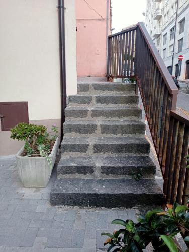a set of stairs leading up to a building at San Giovanni Apartment in Catanzaro