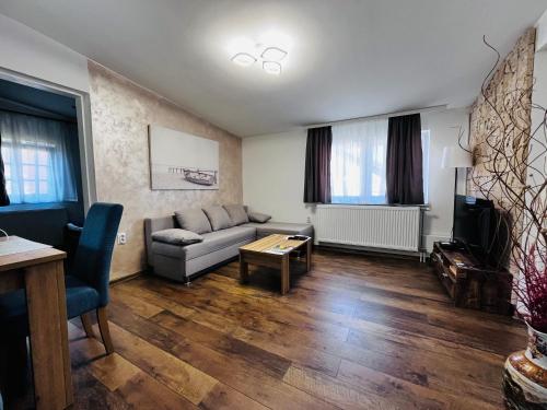a living room with a couch and a table at Vasilija in Sremski Karlovci