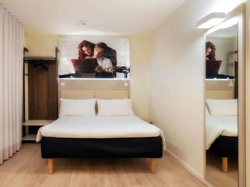 Ein Bett oder Betten in einem Zimmer der Unterkunft ibis Locarno