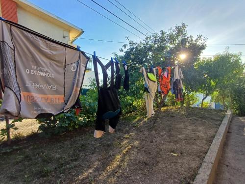 a bunch of clothes hanging on a clothes line at Casa da Tia Lena in Coimbra