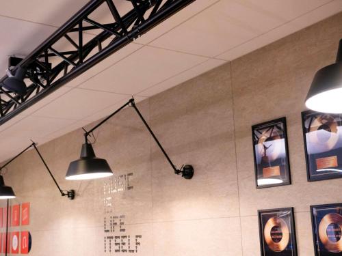 a room with three lights hanging from the ceiling at ibis Styles Nancy Centre Gare in Nancy
