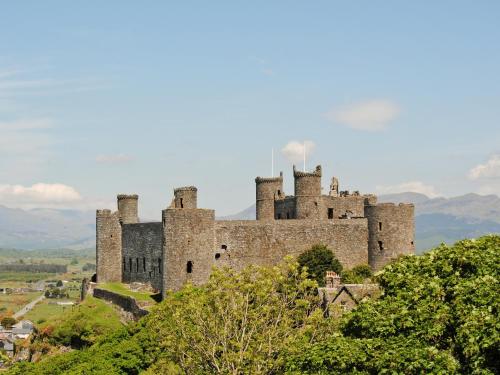 an old castle on top of a hill at Bod Eithin in Harlech