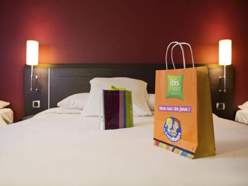 Ένα ή περισσότερα κρεβάτια σε δωμάτιο στο Ibis Styles Metz Centre Gare