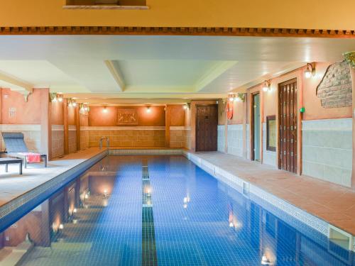 a large swimming pool in a building with at Threshing Barn - Kza in Glaisdale