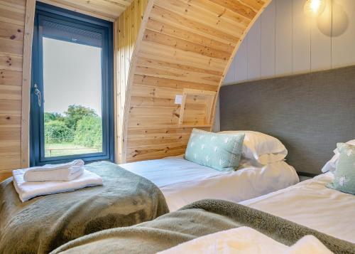 Katil atau katil-katil dalam bilik di Firtree Farm Lodges
