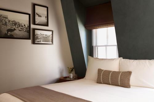 Ένα ή περισσότερα κρεβάτια σε δωμάτιο στο Hotel Albatross