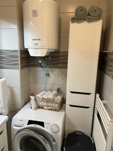 a washer and dryer in a small room at CENTRAL POINT APARTMENT - City centar Zenica- in Zenica