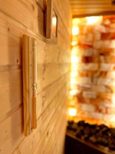 a wood paneled wall with a wooden wall at PINEA Resort in Pobierowo