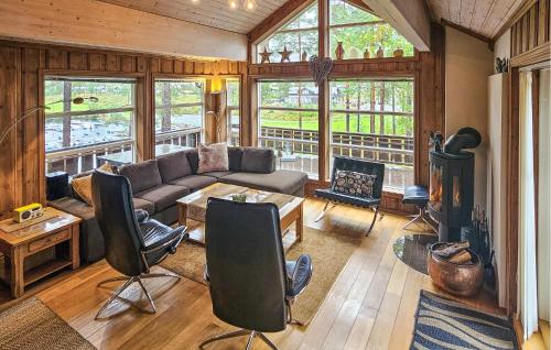 a living room with a couch and a fireplace at Lovely Home In Vrådal With Sauna in Vradal