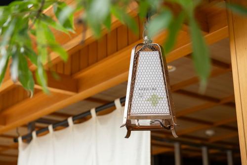 a light hanging from the ceiling of a house at soyo-ne kyoto sanjo in Kyoto