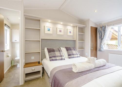Katil atau katil-katil dalam bilik di Calthwaite Hall Lodges