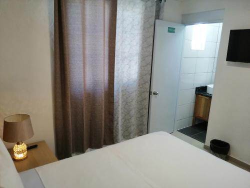 Ένα ή περισσότερα κρεβάτια σε δωμάτιο στο Hotel Yamir