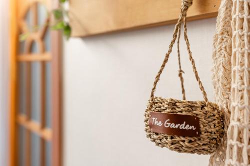 a rattan bag with the garden written on it at Hongik University Station 20 minutes in Seoul