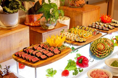a buffet with many different types of food on a table at Coastal Charm Panorama Bayview in Nha Trang