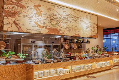 a restaurant with a large map on the wall at Coastal Charm Panorama Bayview in Nha Trang