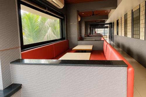 a waiting area of a subway train with a window at The Grantley Hotel - Alibag Beach in Alibag