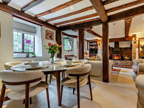 a living room with a table and chairs at 3 bed property in Blandford Forum 83442 in Tarrant Monkton