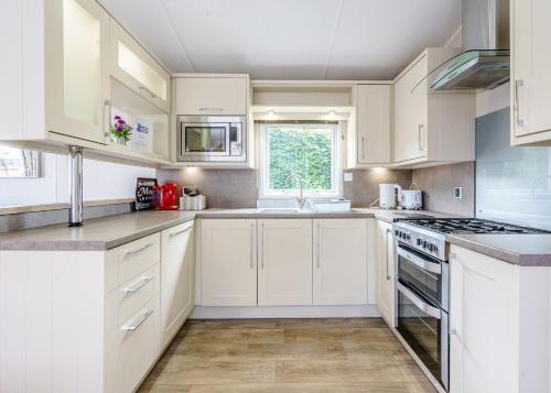 Dapur atau dapur kecil di Calthwaite Hall Lodges