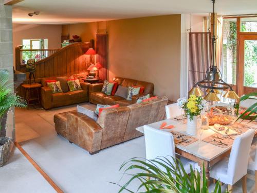 a living room with a couch and a table at Arne Barn in Arne