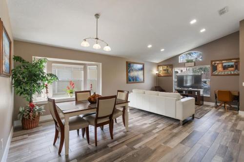 a living room with a table and a white couch at Vacation Home near Disney World! in Kissimmee