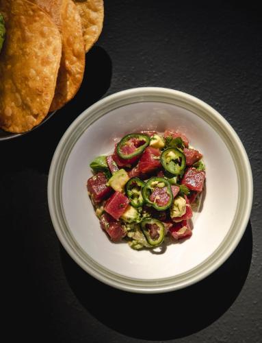 a plate of food with vegetables on a table at The Social Hub Barcelona Poblenou Extended Stay in Barcelona