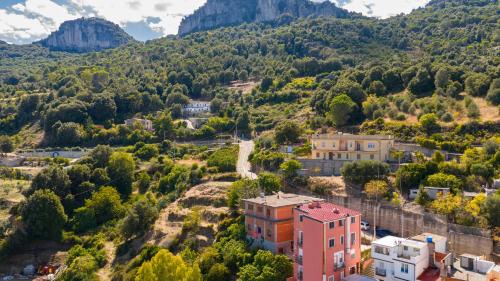 an aerial view of a town in the mountains at Sa omu de sa palgia in Jerzu