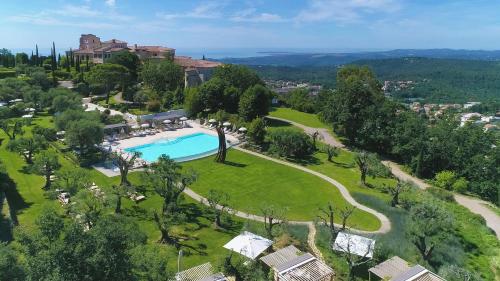 an aerial view of a resort with a swimming pool at Château Saint-Martin & Spa, Oetker Hotels in Vence