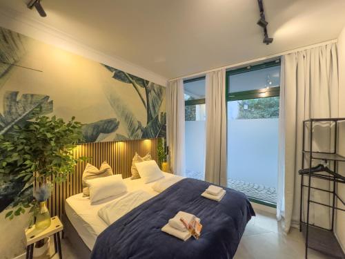 Ένα ή περισσότερα κρεβάτια σε δωμάτιο στο Fried-RICH Apartments