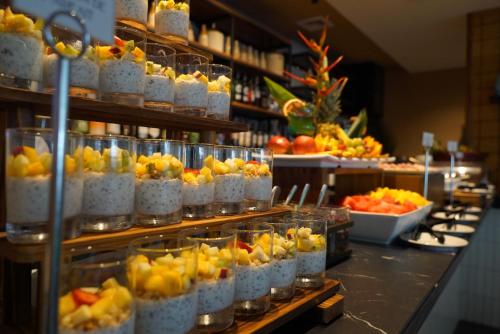 a buffet with many different types of fruit in jars at Radisson Riviera Panama in Punta Chame