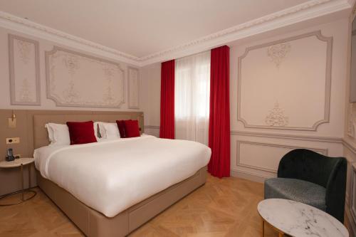 Кровать или кровати в номере Mode Paris Aparthotel
