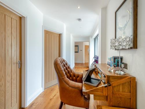 an office with a leather chair and a desk at Foxton Lodge - Uk47296 in Harrietsham