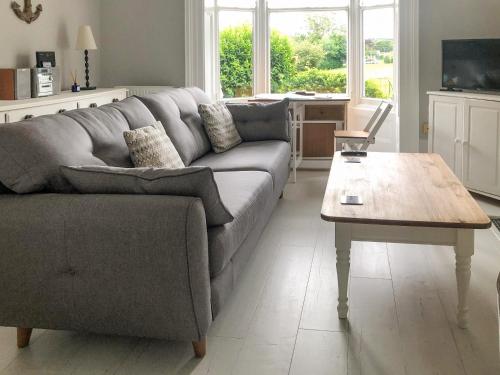 a living room with a couch and a coffee table at Whitby Bliss in Whitby