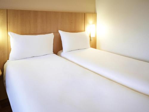 Katil atau katil-katil dalam bilik di ibis Karlsruhe Hauptbahnhof