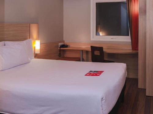 Cama o camas de una habitación en ibis Lima Larco Miraflores