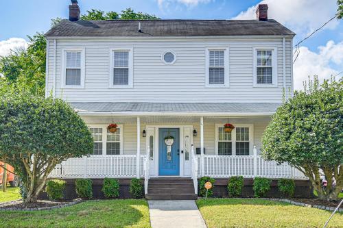 a white house with a blue door at Spacious Family Home with Yard in Dtwn Hampton! in Hampton
